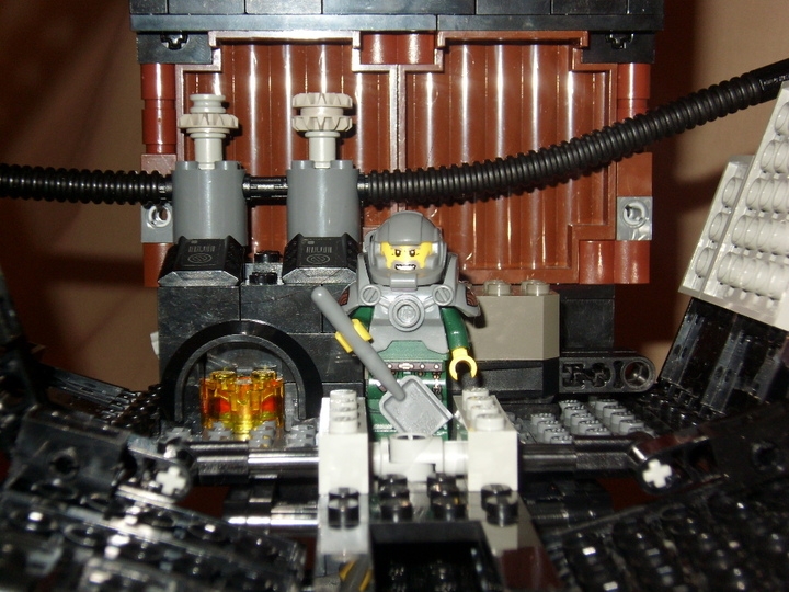 LEGO MOC - Mini-contest 'Zeppelin Battle' - Sky Shark: Чтобы поддерживать двигающую систему,когда дирижабль не лежит в дрейфе на потоках ветра,внутри оборудована система из паровых котлов.Так как внутренняя часть наполнена гелием,а не водородом,то можно обеспечить прямой доступ к огню в топке.Заведует всем кочегар в термозащитном костюме с приводом кислорода.
