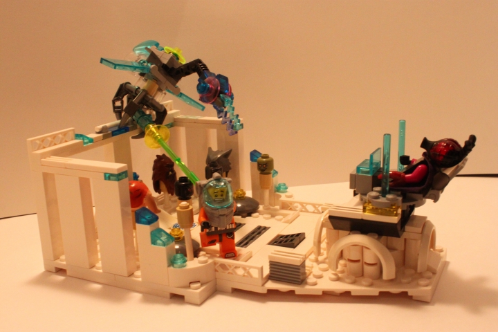 LEGO MOC - Инопланетная жизнь - Последняя жертва: Экспозиция картины - виден рельеф планеты, Охотник, его жертва и головы предыдущих жертв, используемые для подпитки Властителя (на троне)