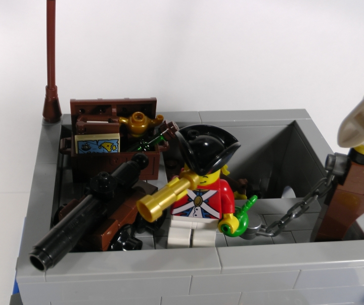 LEGO MOC - LEGO-contest 24x24: 'Pirates' - Бомба для губернатора или Драма на КПП: Обратите внимание на ящик с конфискованным за смену имуществом, стоящий за пушкой. Здешний гарнизон состоит-таки из романтиков...